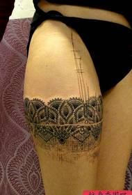 a sexy lace tattoo picture on the thigh
