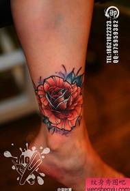 Beautiful female rose tattoo pattern on girls' legs