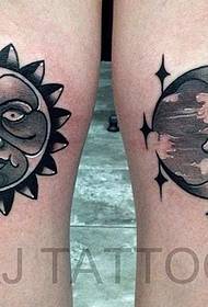 Woman legs sun moon tattoo work