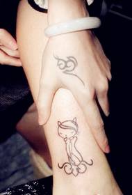 Girl hand back totem with leg kitten tattoo