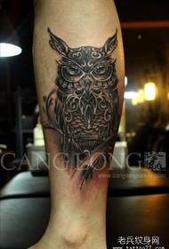 An owl tattoo pattern with cool men's legs