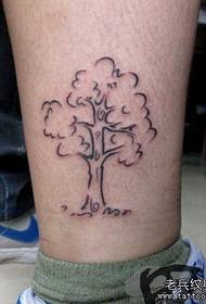 a popular small totem tree tattoo pattern on the leg
