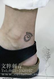 smiley face tattoo on the ankle