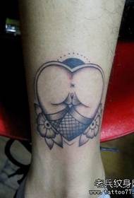 an alternative love tattoo pattern on the leg