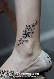 a star tattoo on the ankle