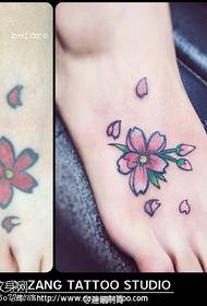 Peach flower tattoo on the foot