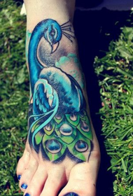 beautiful peacock tattoo work on the instep