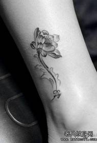 Beautiful female lotus tattoo pattern on girls' legs