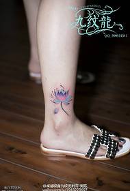 watercolor lotus flower tattoo on the ankle