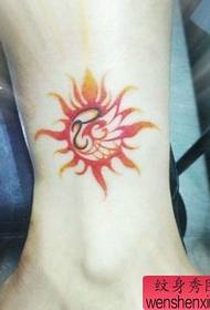a beautiful color totem sun tattoo pattern on the leg