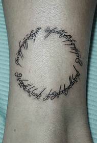 creative round English tattoo on the bare feet meaning extraordinary