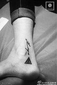 triangle letter tattoo on the ankle