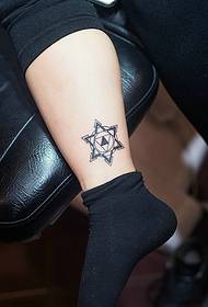 a set of cute little totem tattoo pictures on bare feet