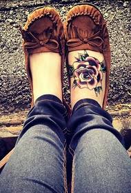 Beautiful and beautiful colored rose tattoo picture on female instep