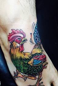 finely colored cock tattoo picture on the back