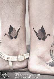 Thousand paper crane tattoo pattern on the ankle