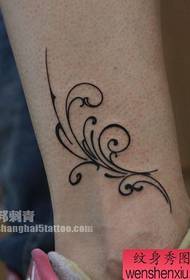 girl's leg nice totem vine tattoo pattern