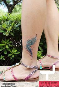woman's ankle color feather tattoo picture
