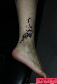 a woman's foot a personalized flower tattoo pattern
