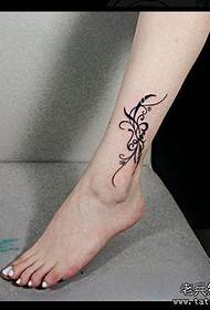 woman's foot cute flower tattoo pattern