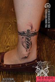 tattoo figure recommended a woman's ankle cross wings tattoo works