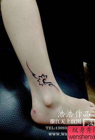 The beautiful totem lotus tattoo pattern at the girls' ankles