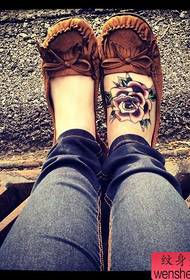 woman's instep color rose tattoo tattoo