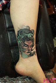 Umfanekiso wobubi weMedusa ankle tattoo