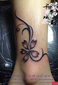 woman's foot a flower tattoo pattern