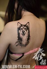 a woman's back cute dog and love tattoo pattern