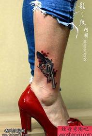 tattoo figure recommended a woman's ankle pistol tattoo works