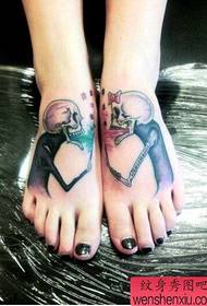 woman's instep creative skull tattoo work