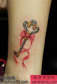 ankle key bow tattoo pattern shared by tattoo show