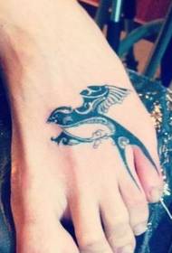 a foot totem swallow tattoo pattern