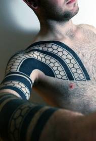 male arm and chest tribal style black and white geometric tattoo pattern