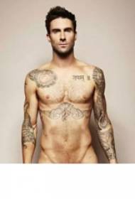 International tattoo star Adam Levine under the chest of black eagle tattoo pictures