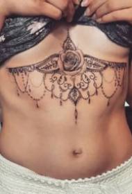 sexy brahma tattoo artwork under the female chest