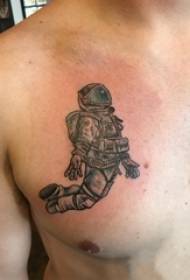 tattoo borst mannelijke jongens borst zwarte astronaut tattoo foto's
