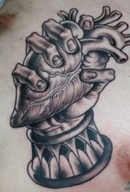 chest black gray heart hand tattoo pattern