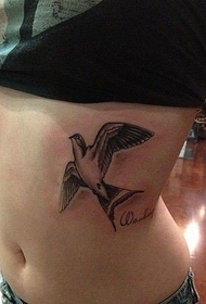 girl under the chest small swallow tattoo picture