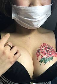 sexy rose tattoo pattern on the chest of beautiful breasts