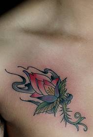 a thorn flower tattoo on the chest