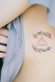 girl chest side branch triangle tattoo