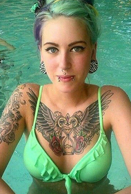 girl chest hourglass wings tattoo