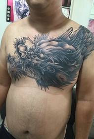 classic domineering dragon tattoo pattern around the shoulder