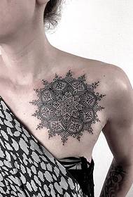 Woman's left chest on the delicate decorative style mandala flower tattoo picture