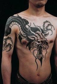 personal male chest over shoulder dragon tattoo