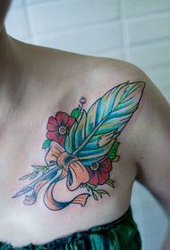 clavicle personality feather bow tattoo