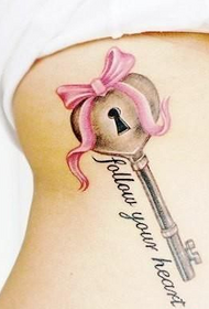 personal chest under the heart key tattoo