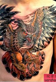 a popular owl tattoo work on the chest